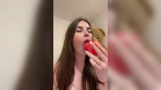 Adorable Babe Deeply Sucks a Dildo While Bouncing on Bed Video