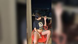 Ninfeta andely nude showing off on the porch smoking a cigarette