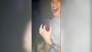 Guy getting his dick sucked in a club by a total slut.