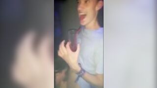 Guy getting his dick sucked in a club by a total slut.