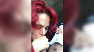 Redhead swallowing a big load of cum in the car.