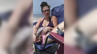 Milf gets super wet touching her hairy pussy at the public beach