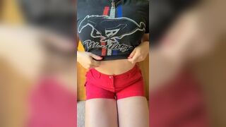Naughty girl in shorts showing her tits