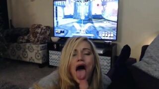 Blonde goddess swallowing cum while the guy is playing a game.