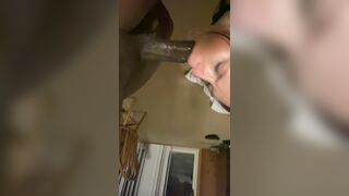 Girl getting her throat fucked hard by a black dick.