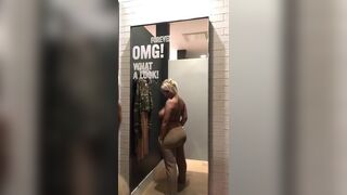 Woman changing clothes in dressing room