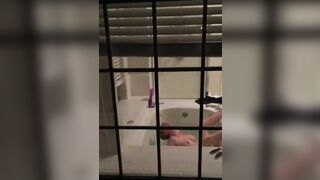 Dude filming his sister stimulating her pussy in the bathtub.