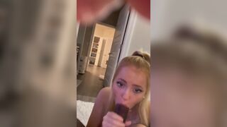 Blonde college girl having fun with a black cock in her mouth.