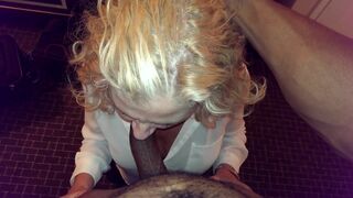 Beautiful mature blonde on her knees sucking a black cock