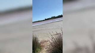 Woman does risky oral porno on the beach