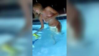 Gorgeous unhinged young jumps into pool topless