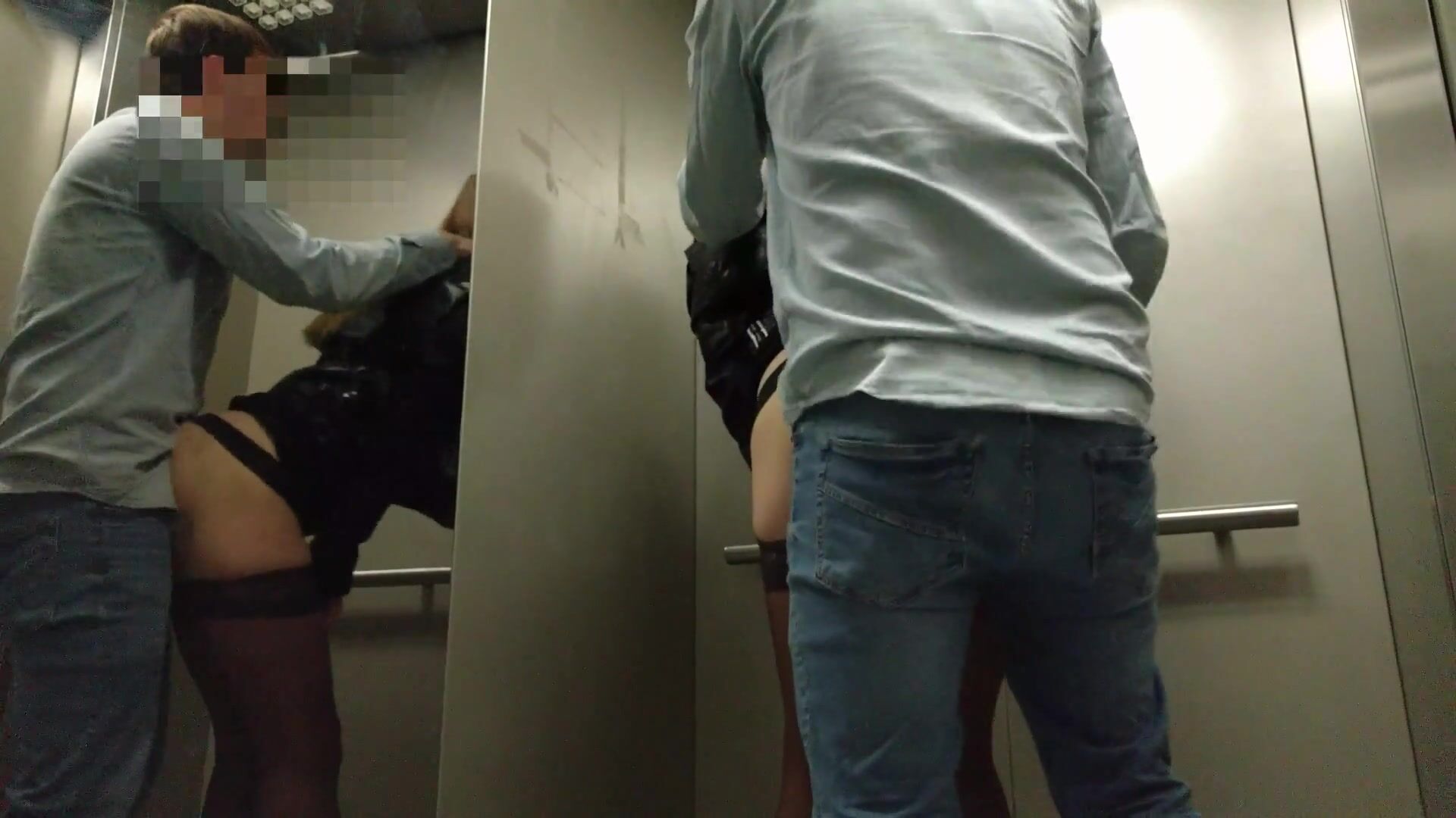 Voyeur couple does risky public porno in an elevator image